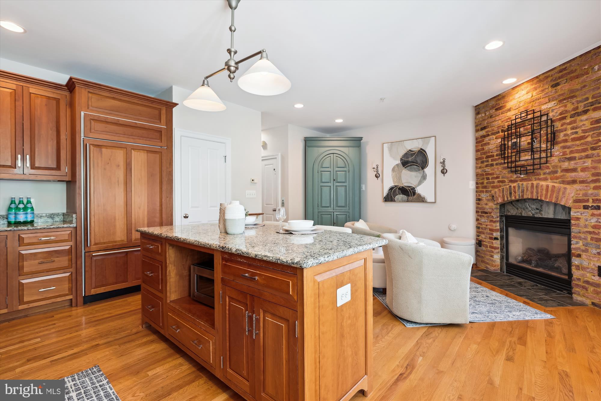 229 Locust Street Southeast, Unit 3 Vienna, VA 22180 - Photo 10 of 57 a kitchen with stainless steel appliances granite countertop a sink cabinets and wooden floor