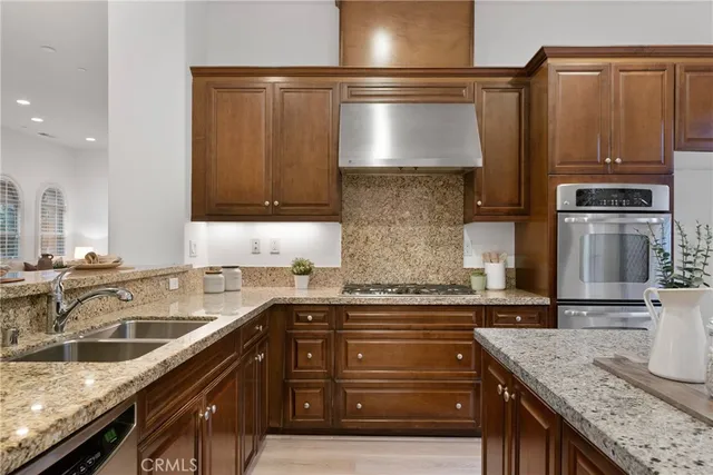 a bedroom with bed and a potted plant