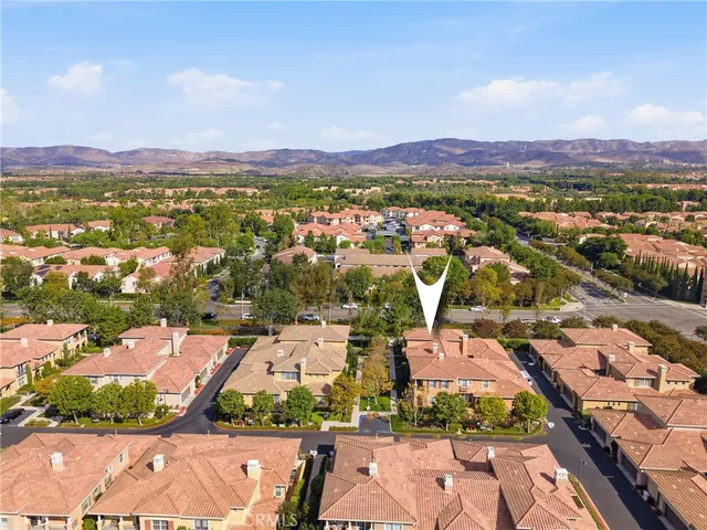 an aerial view of a city with lots of residential buildings