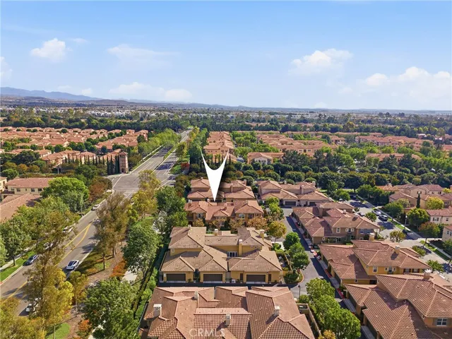 an aerial view of residential building with city view