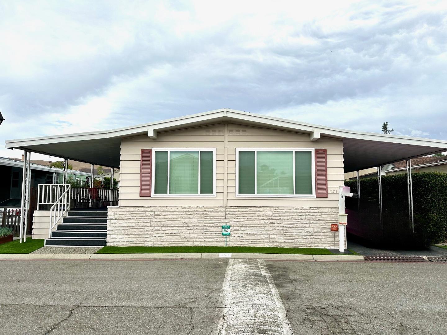 6130 Monterey Road, Unit 201 San Jose, CA 95138 - Photo 1 of 13 a front view of a house with a garage