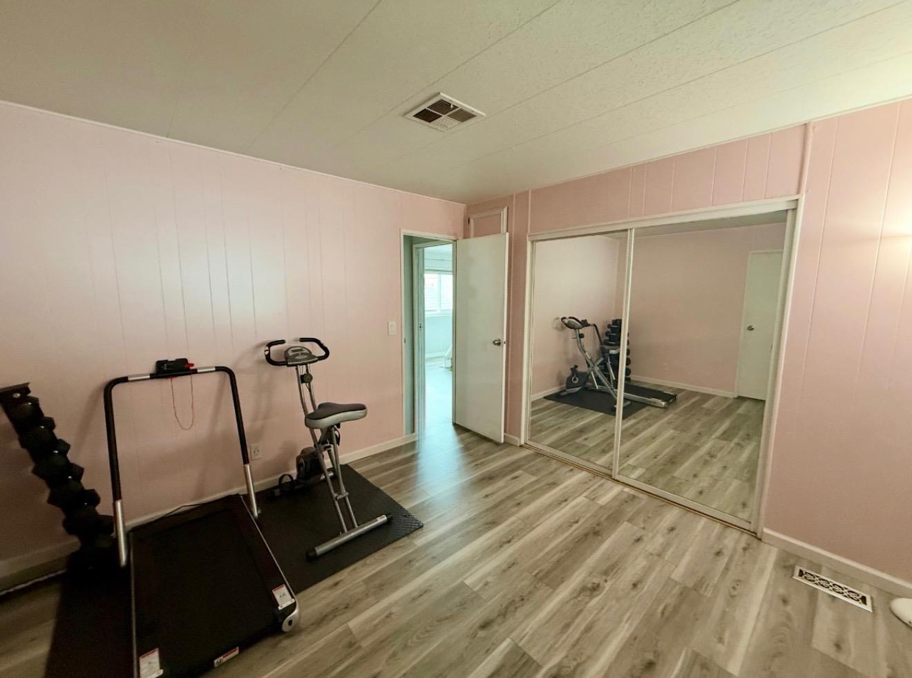 6130 Monterey Road, Unit 201 San Jose, CA 95138 - Photo 9 of 13 a view of a room with wooden floor
