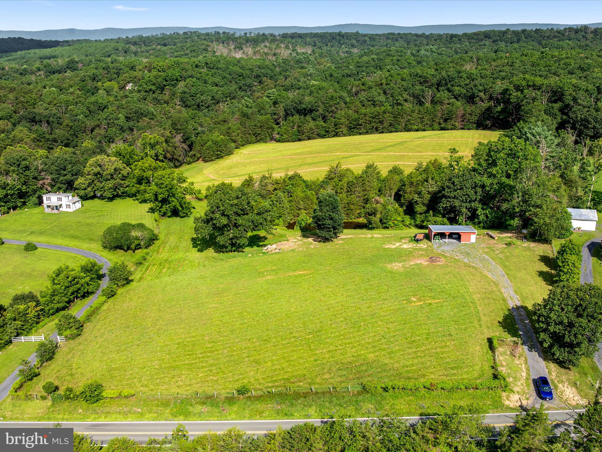 Senedo Mount Jackson, VA 22842 - Photo 5 of 16 a view of a large pool with lawn chairs and large trees