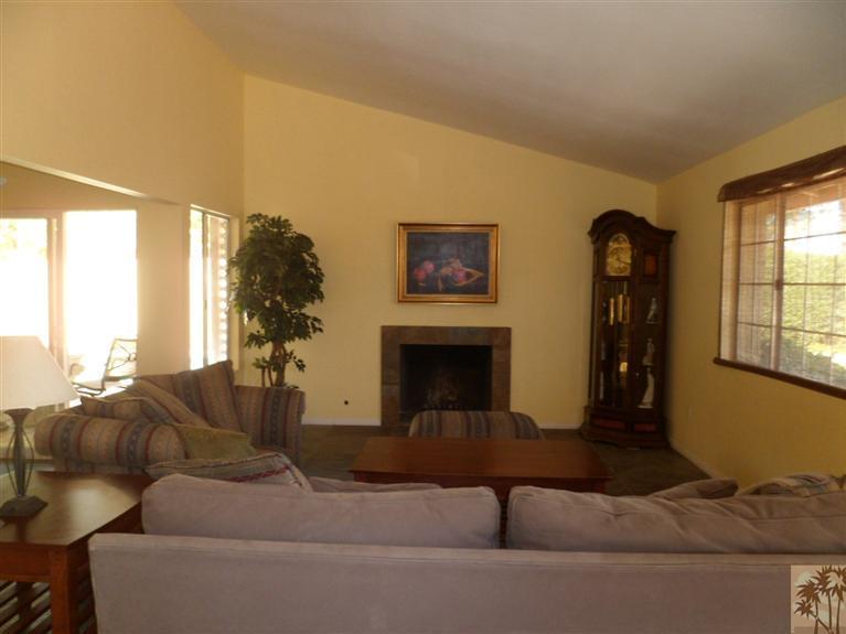 71421 Gardess Road Rancho Mirage, CA 92270 - Photo 1 of 6 a living room with furniture and a fireplace