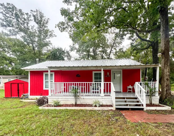 a view of house with outdoor seating