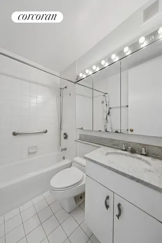 a stove top oven sitting inside of a kitchen