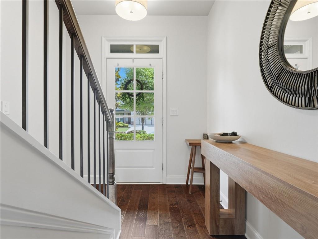 147 Fieldbrook Crossing Canton, GA 30115 - Photo 19 of 46 a view of a hallway with wooden floor and staircase