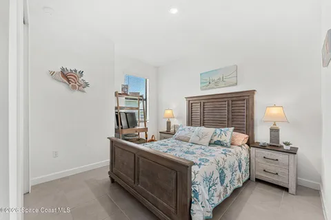 a bed room with a bed and a window