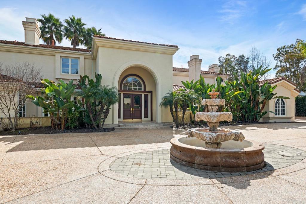 6773 Poco Lago Rancho Santa Fe, CA 92067 - Photo 9 of 65 a view of a house with fountain in a patio