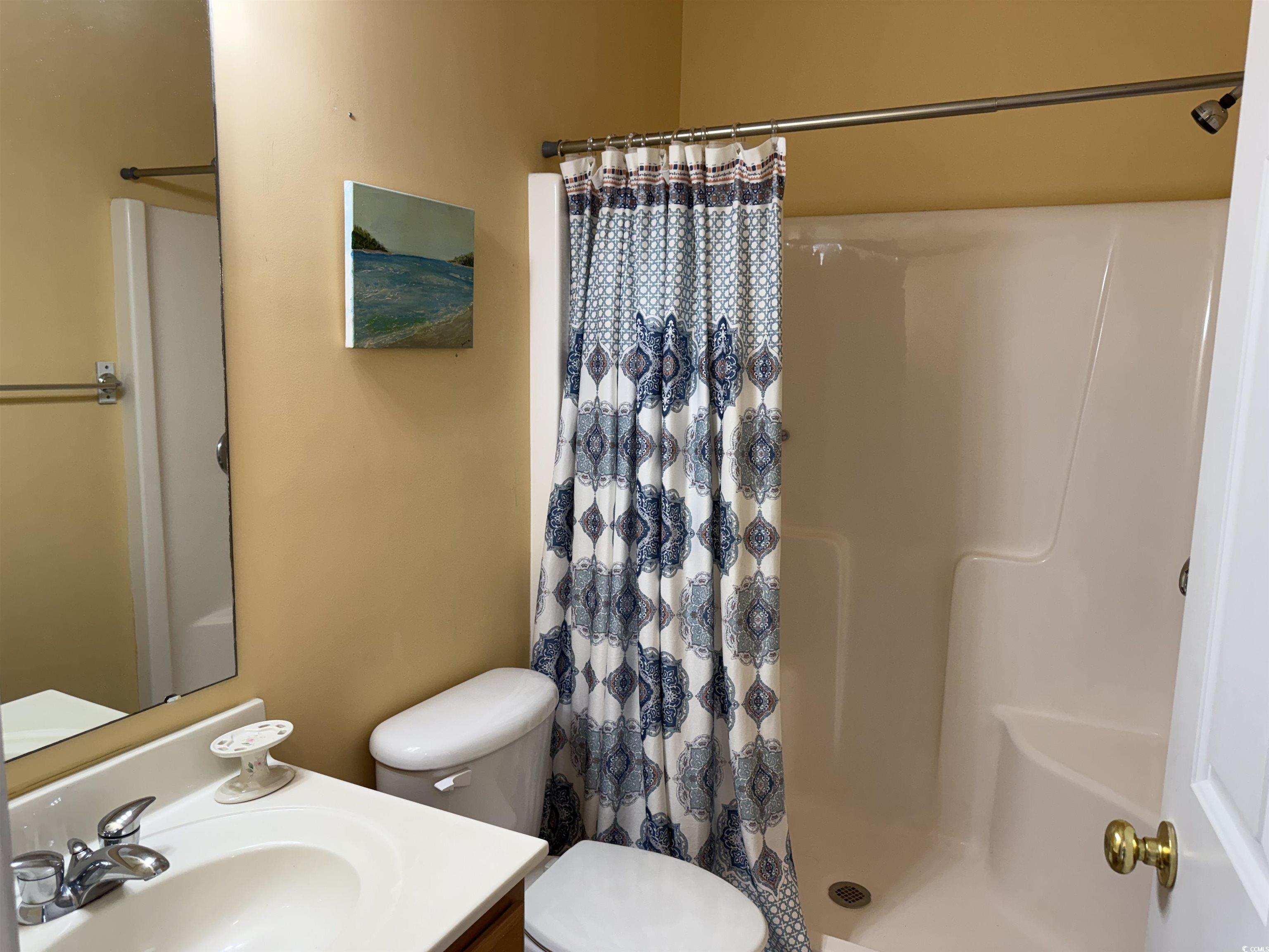 5858 Longwood Drive, Unit #204 Murrells Inlet, SC 29576 - Photo 4 of 13 Bathroom featuring a stall shower and vanity