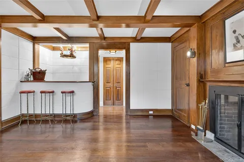 a view of outdoor space with wooden floor and windows