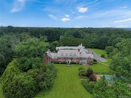 an aerial view of a house with a garden