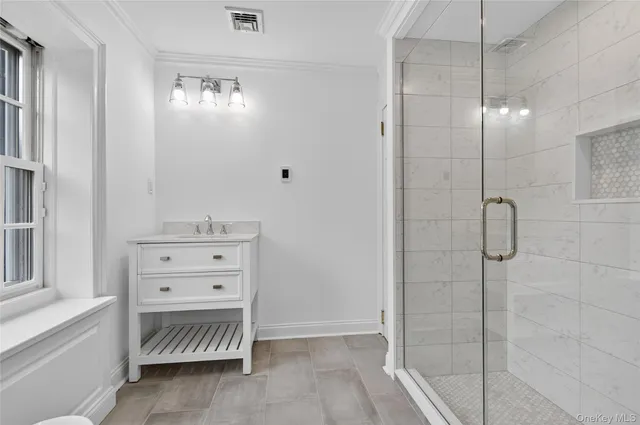 a bathroom with a sink and mirror