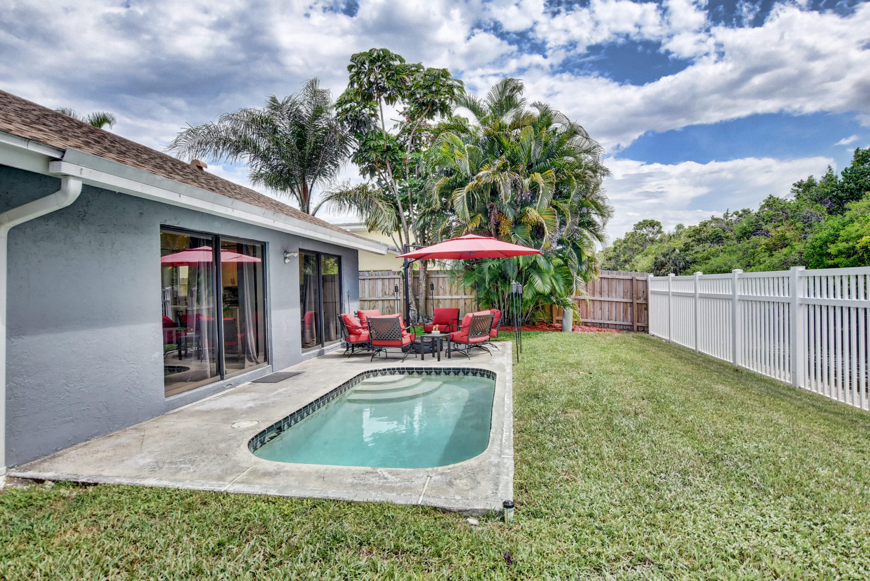 7445 Texas Trail Boca Raton, FL 33487 - Photo 27 of 28 a view of a house with backyard porch and furniture