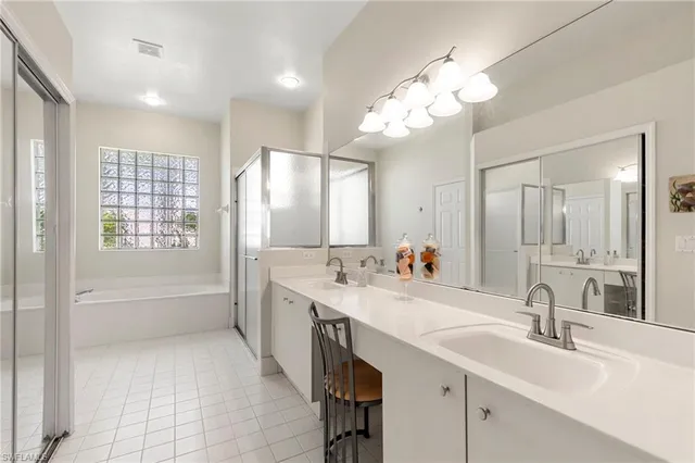 a white bath tub sitting next to a window
