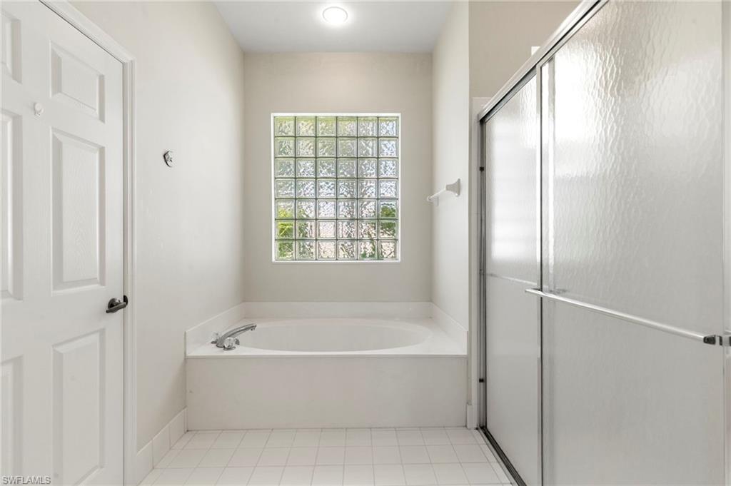 860 Grand Rapids Boulevard Naples, FL 34120 - Photo 13 of 44 a white bath tub sitting next to a window