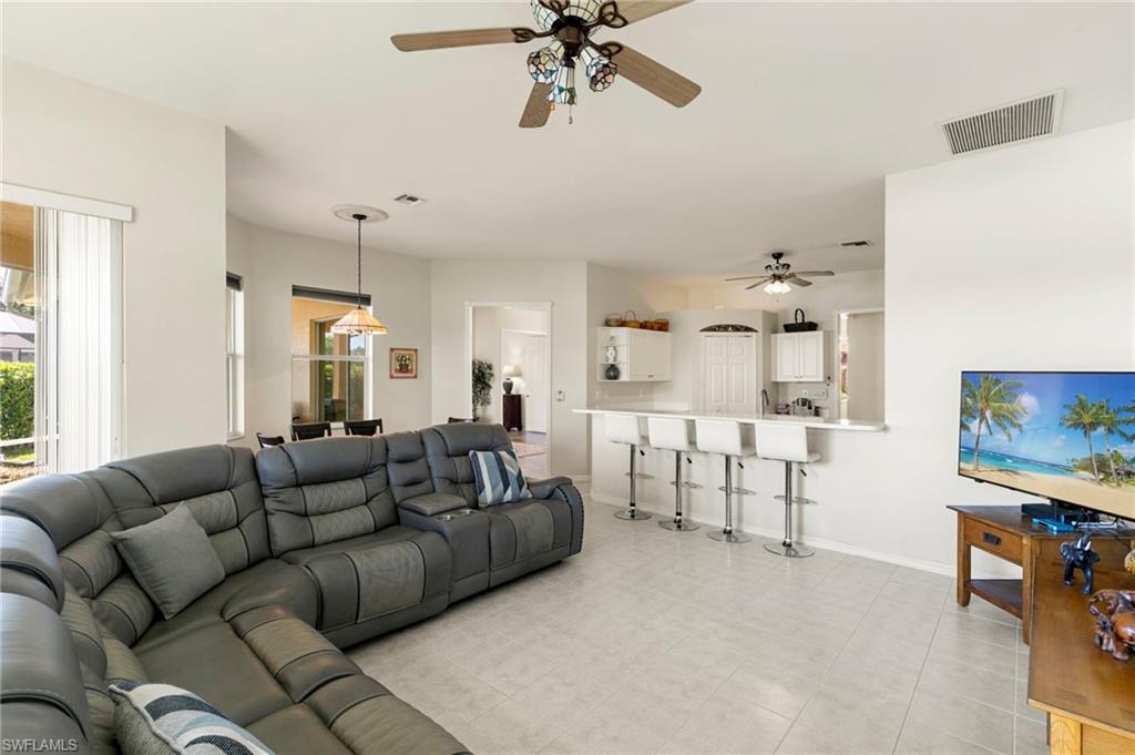 860 Grand Rapids Boulevard Naples, FL 34120 - Photo 14 of 44 a living room with furniture and a large window