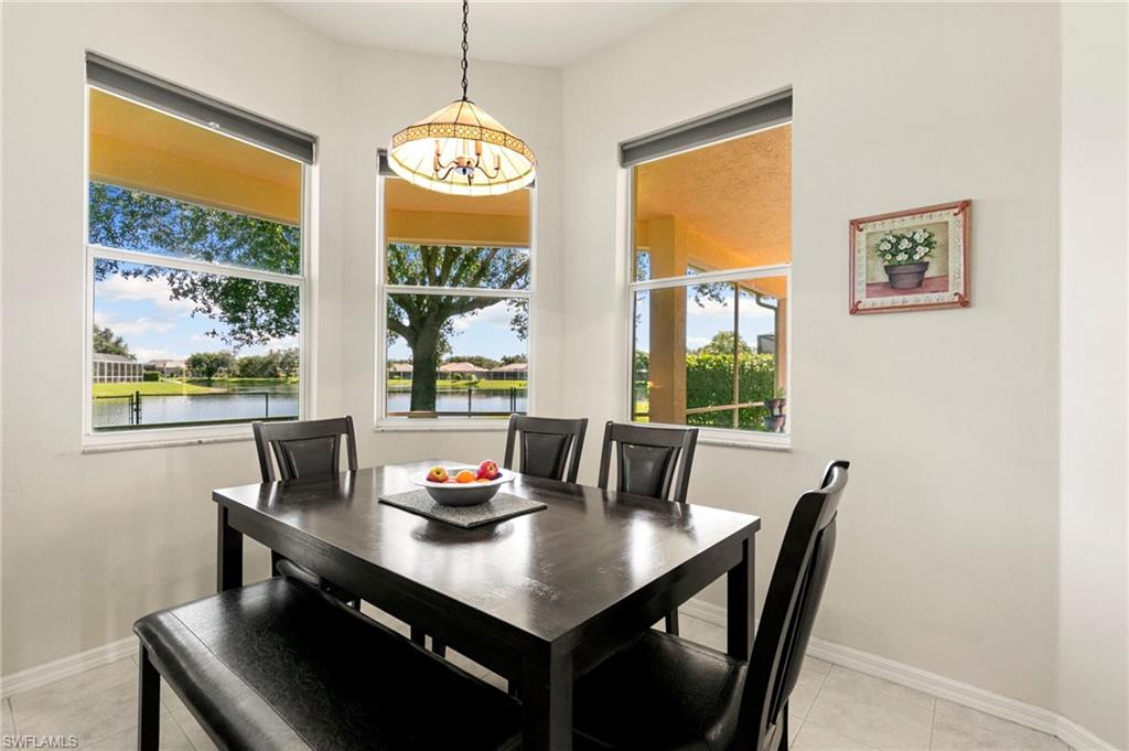 860 Grand Rapids Boulevard Naples, FL 34120 - Photo 15 of 44 a view of a dining room with furniture window and outside view
