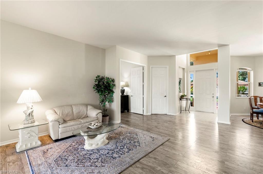 860 Grand Rapids Boulevard Naples, FL 34120 - Photo 16 of 44 a living room with furniture and a potted plant
