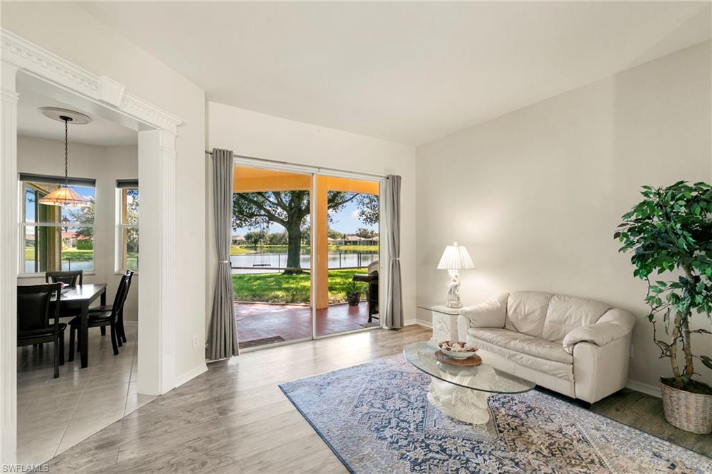 860 Grand Rapids Boulevard Naples, FL 34120 - Photo 17 of 44 a living room with furniture and a large window