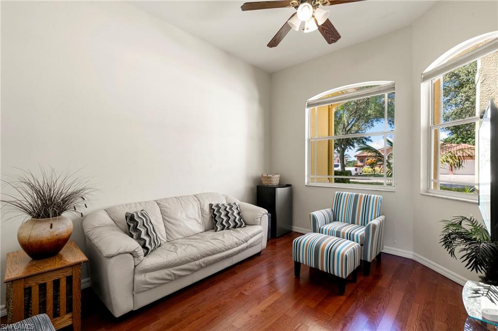 860 Grand Rapids Boulevard Naples, FL 34120 - Photo 18 of 44 a living room with furniture and a large window