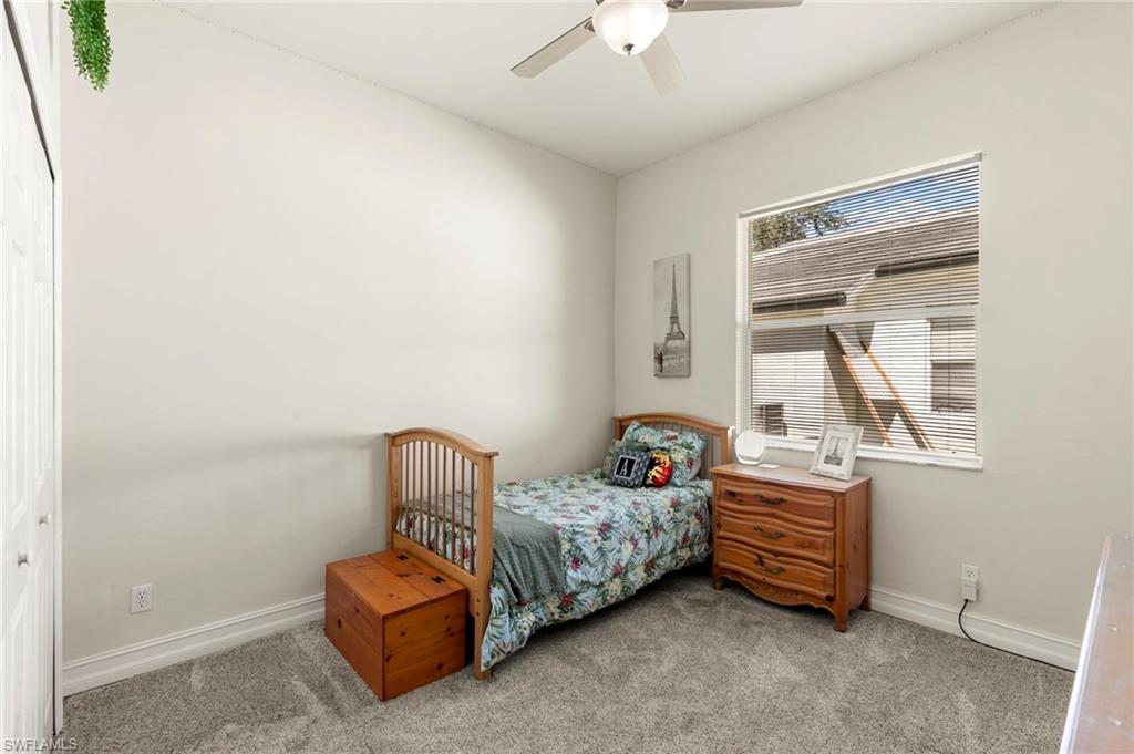 860 Grand Rapids Boulevard Naples, FL 34120 - Photo 21 of 44 a bedroom with bed and window