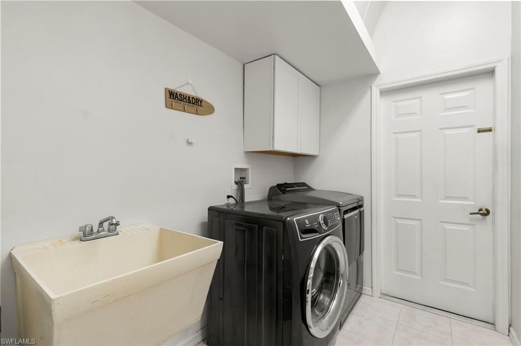 860 Grand Rapids Boulevard Naples, FL 34120 - Photo 24 of 44 a utility room with sink dryer and washer