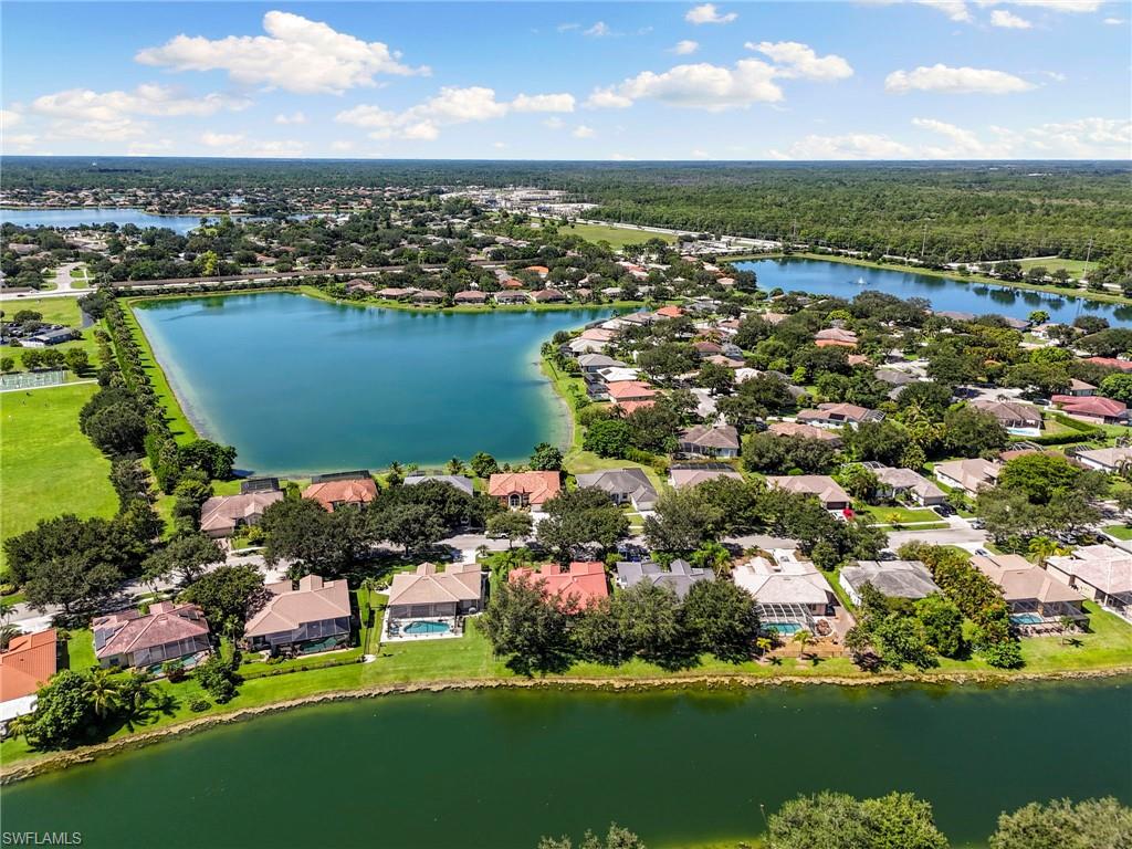 860 Grand Rapids Boulevard Naples, FL 34120 - Photo 38 of 44 an aerial view of a house with a lake view