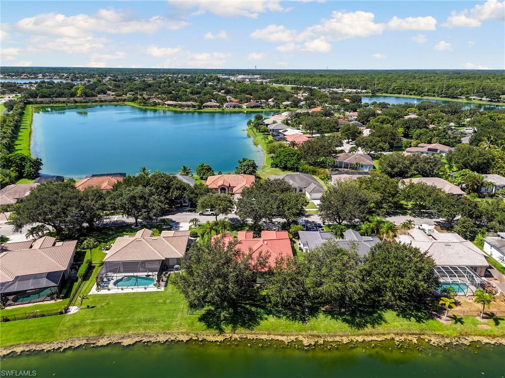 860 Grand Rapids Boulevard Naples, FL 34120 - Photo 39 of 44 an aerial view of residential houses with outdoor space and lake view