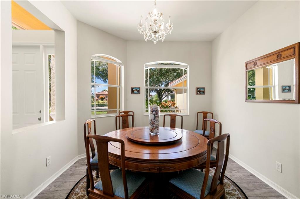 860 Grand Rapids Boulevard Naples, FL 34120 - Photo 8 of 44 a view of a dining room with furniture window and outside view