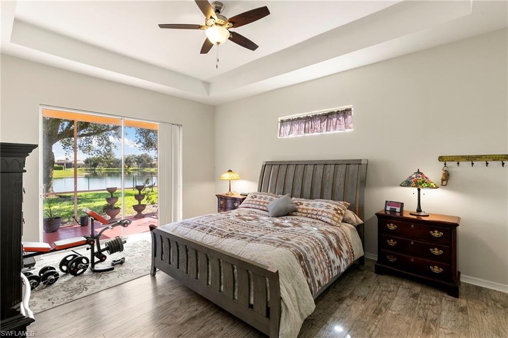 860 Grand Rapids Boulevard Naples, FL 34120 - Photo 10 of 44 a bedroom with a bed and a large window