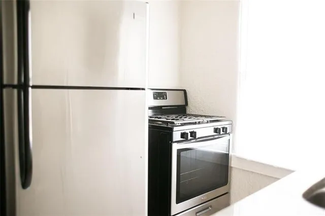 a kitchen with a stove and a microwave