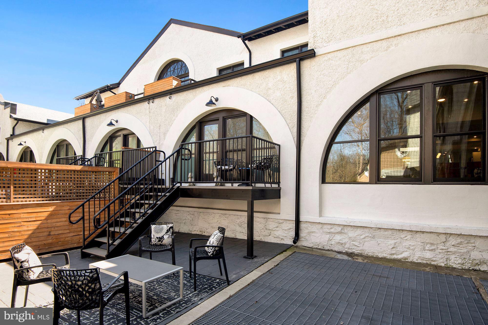 2701 Hume Drive, Unit PP1 Silver Spring, MD 20910 - Photo 16 of 26 Large patio. View of two half moon windows in rear