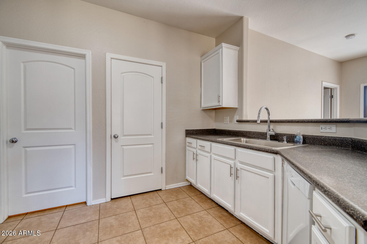 2565 South Signal Butte Road, Unit 46 Mesa, AZ 85209 - Photo 16 of 41 a kitchen with a sink and cabinets
