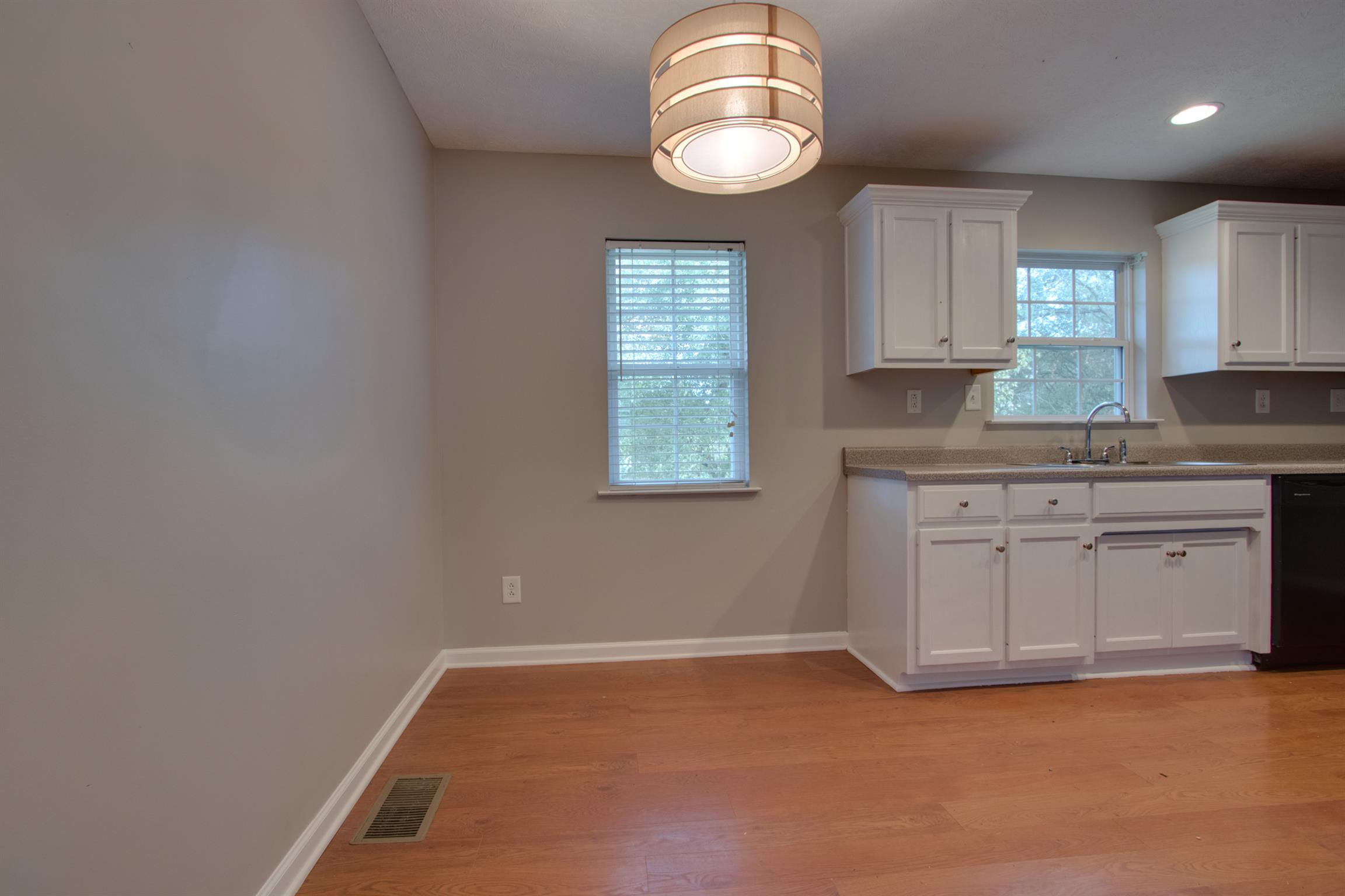 201 High Street Alexandria, TN 37012 - Photo 13 of 23 a kitchen with granite countertop a sink cabinets and window