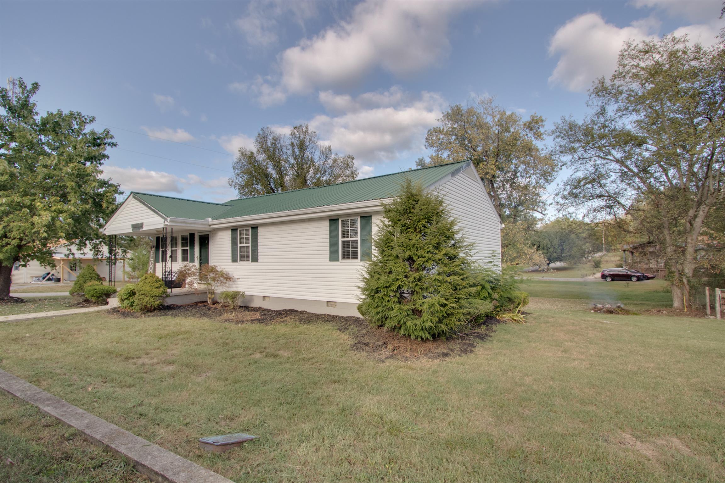 201 High Street Alexandria, TN 37012 - Photo 3 of 23 a view of a house with a outdoor space