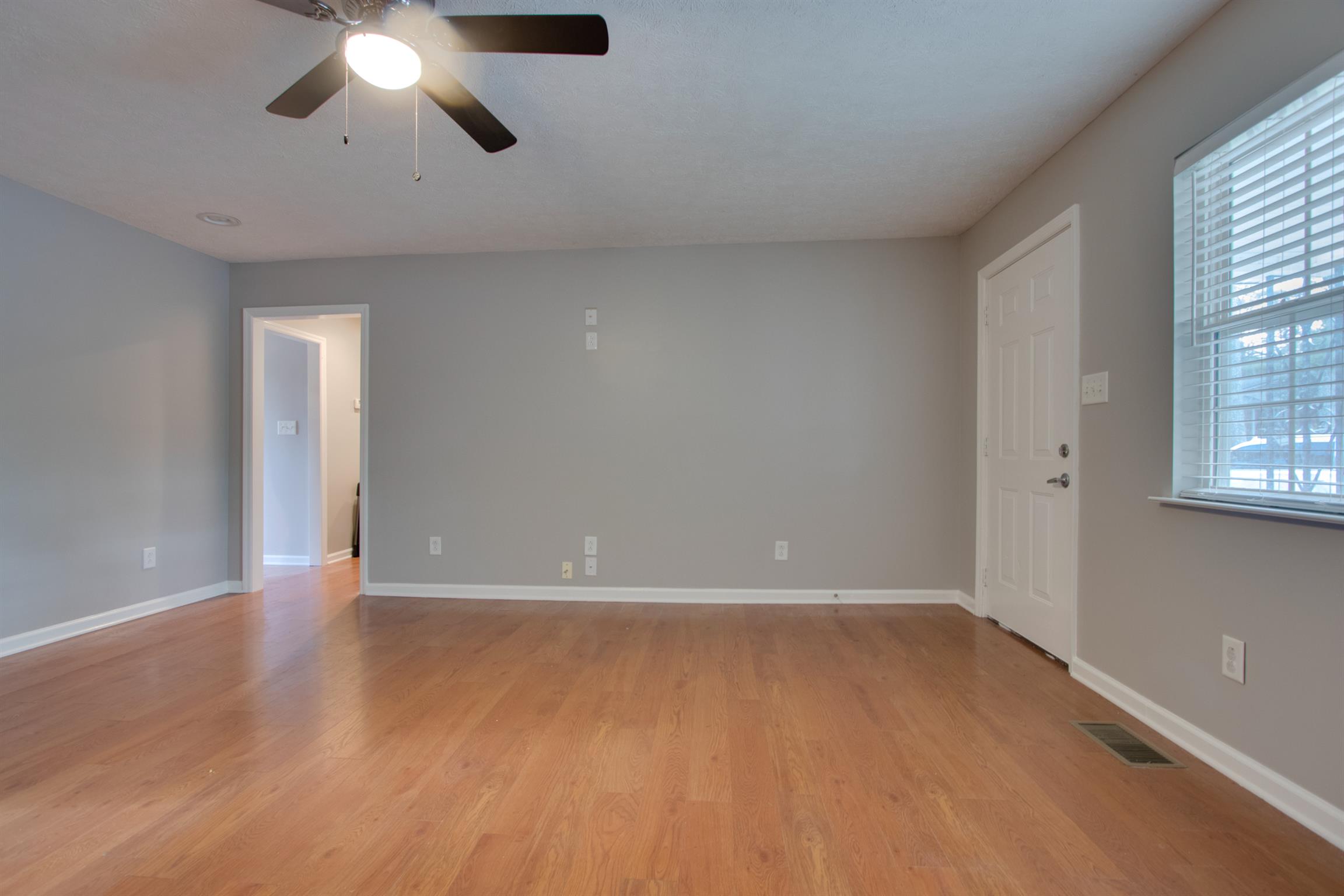 201 High Street Alexandria, TN 37012 - Photo 6 of 23 wooden floor in an empty room with a window