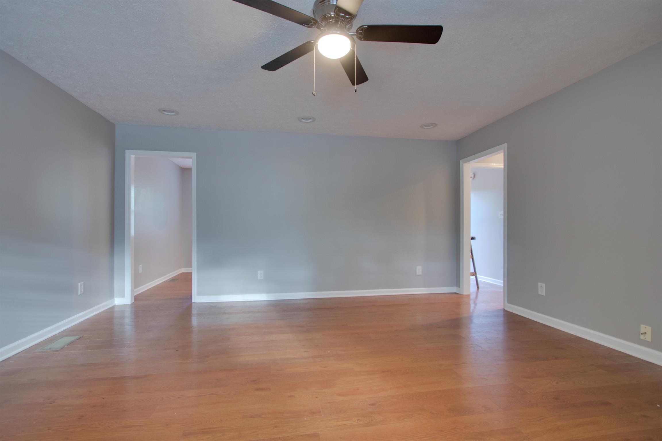 201 High Street Alexandria, TN 37012 - Photo 7 of 23 a view of an empty room with wooden floor