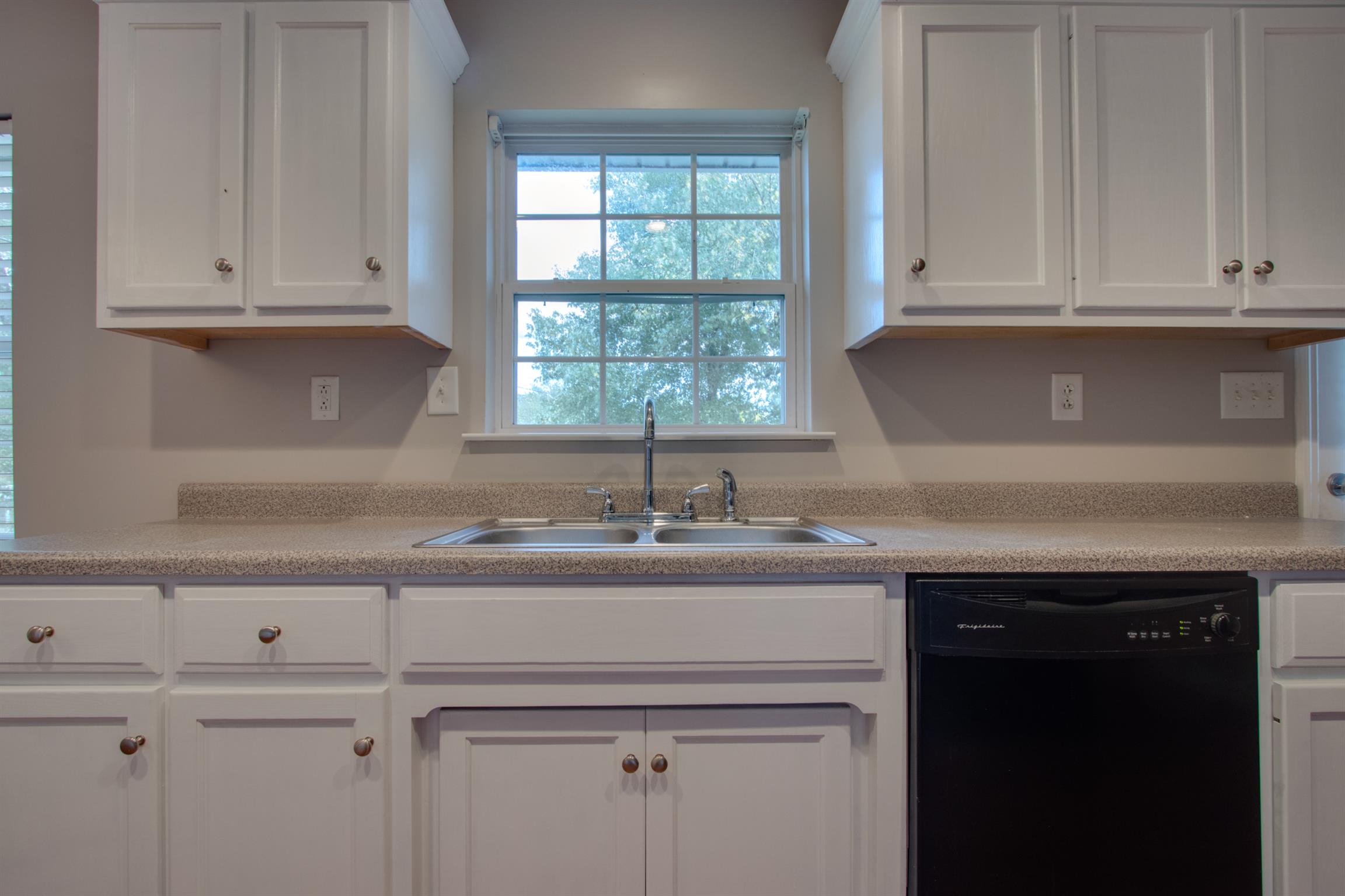 201 High Street Alexandria, TN 37012 - Photo 10 of 23 a kitchen with granite countertop white cabinets and a sink