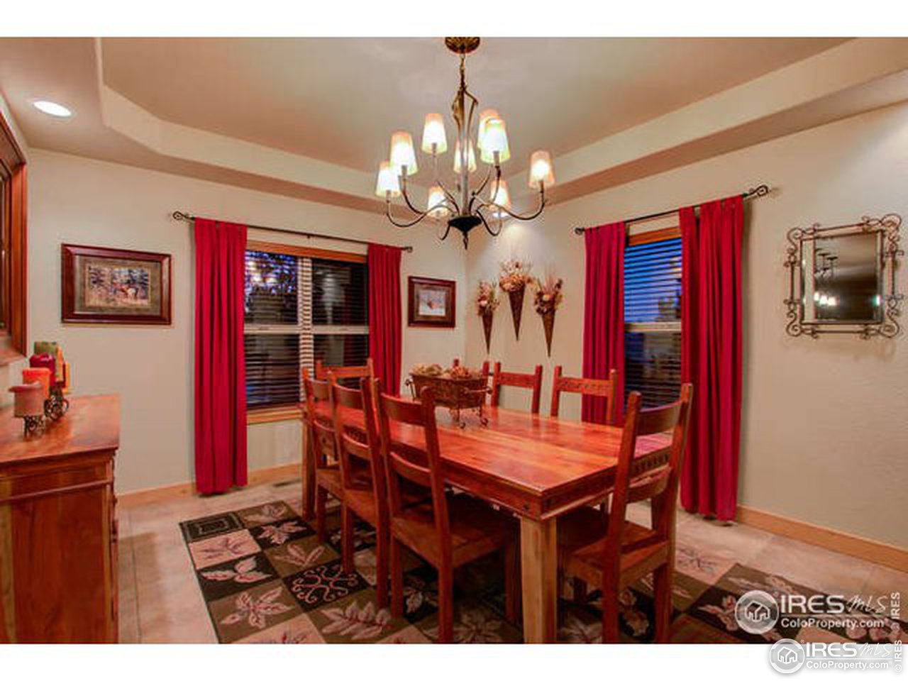 1441 Shelby Drive Berthoud, CO 80513 - Photo 16 of 40 a view of a dining room with furniture and chandelier