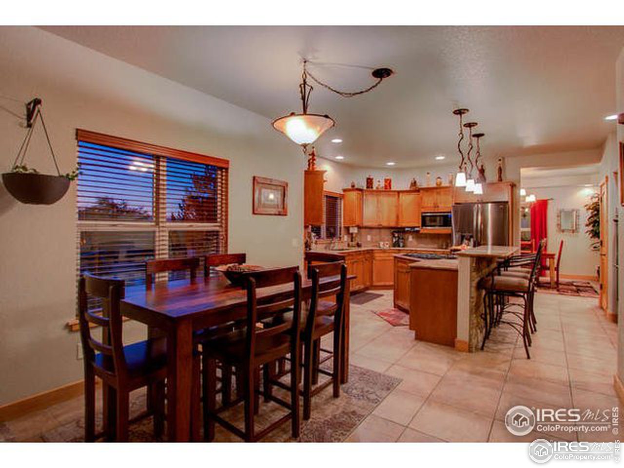 1441 Shelby Drive Berthoud, CO 80513 - Photo 17 of 40 a view of a dining room with furniture and chandelier