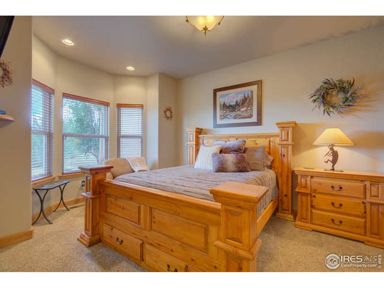 1441 Shelby Drive Berthoud, CO 80513 - Photo 25 of 40 a bedroom with a bed and a table in it