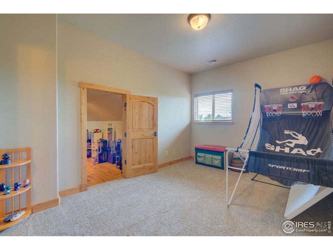1441 Shelby Drive Berthoud, CO 80513 - Photo 26 of 40 a living room with furniture and a wooden floor