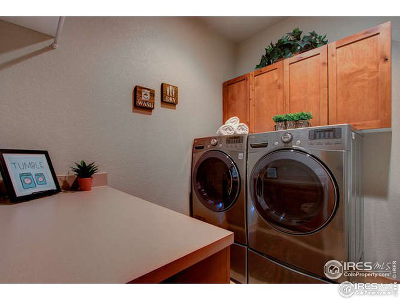 1441 Shelby Drive Berthoud, CO 80513 - Photo 29 of 40 a view of a bedroom with washer and dryer