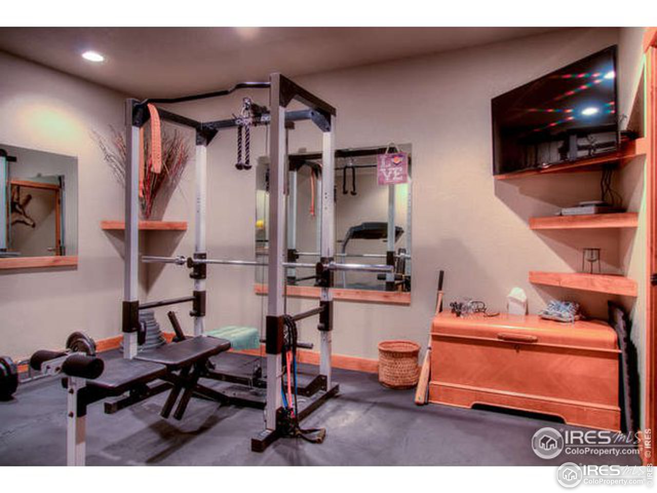 1441 Shelby Drive Berthoud, CO 80513 - Photo 30 of 40 a reading room with furniture and a flat screen tv