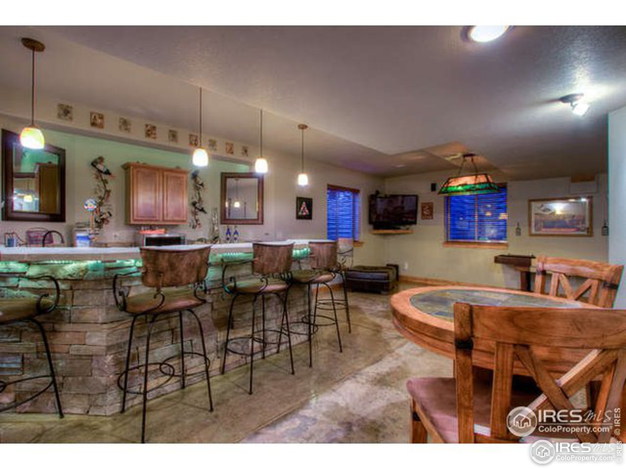 1441 Shelby Drive Berthoud, CO 80513 - Photo 31 of 40 a living room with lots of furniture and a dining table with kitchen view