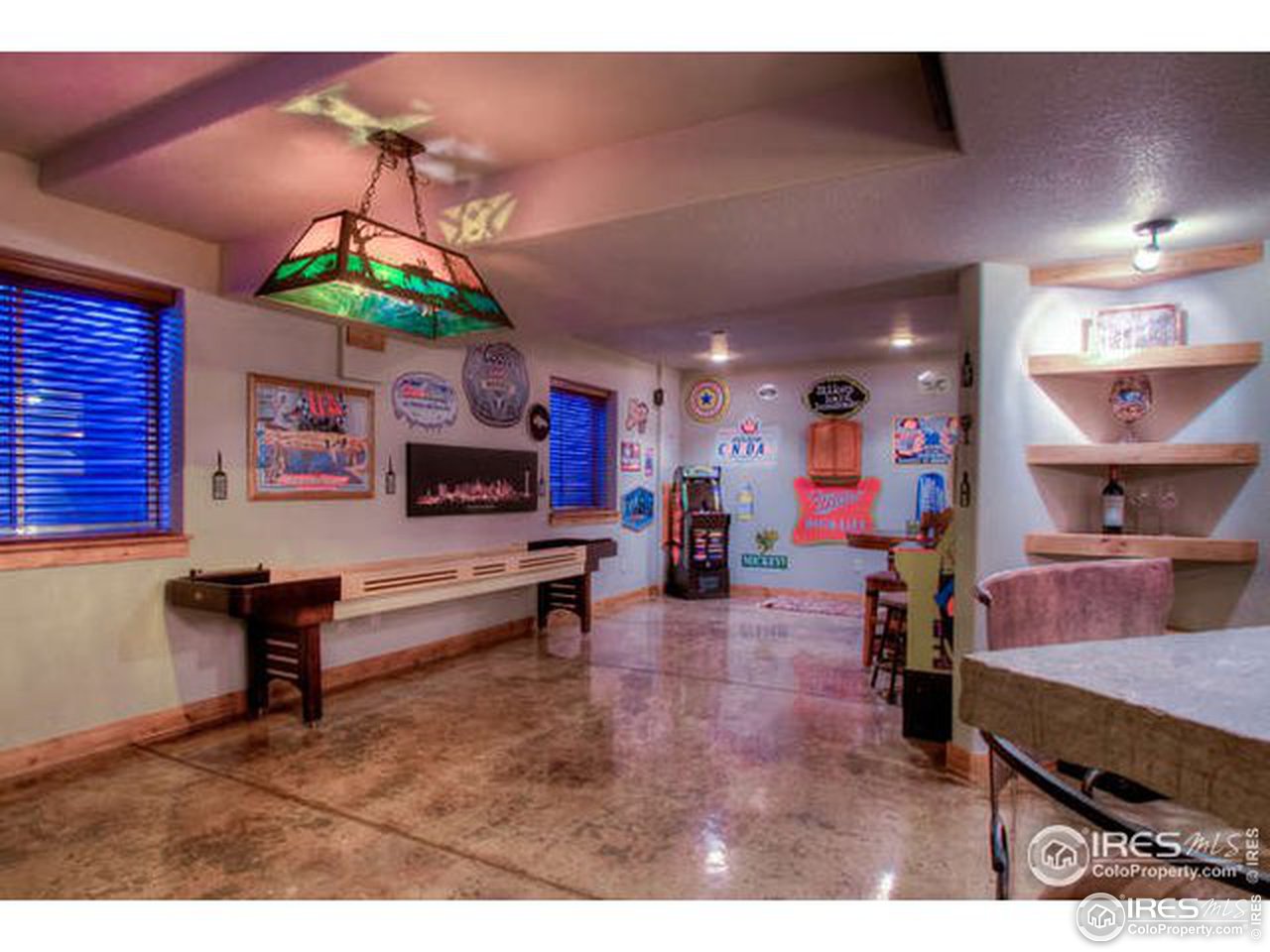 1441 Shelby Drive Berthoud, CO 80513 - Photo 33 of 40 a living room with furniture and a flat screen tv