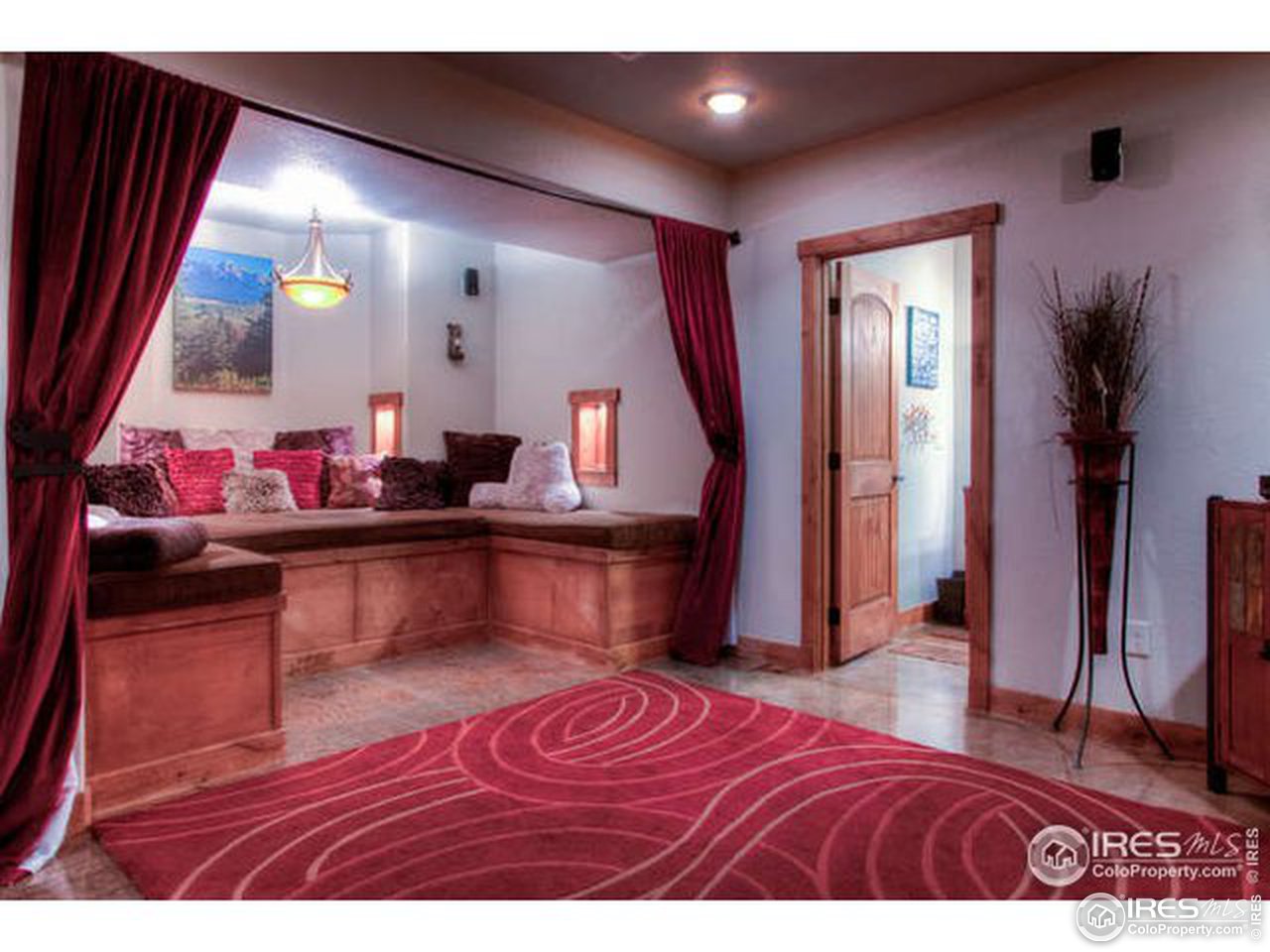 1441 Shelby Drive Berthoud, CO 80513 - Photo 36 of 40 a living room with a couch and a potted plant