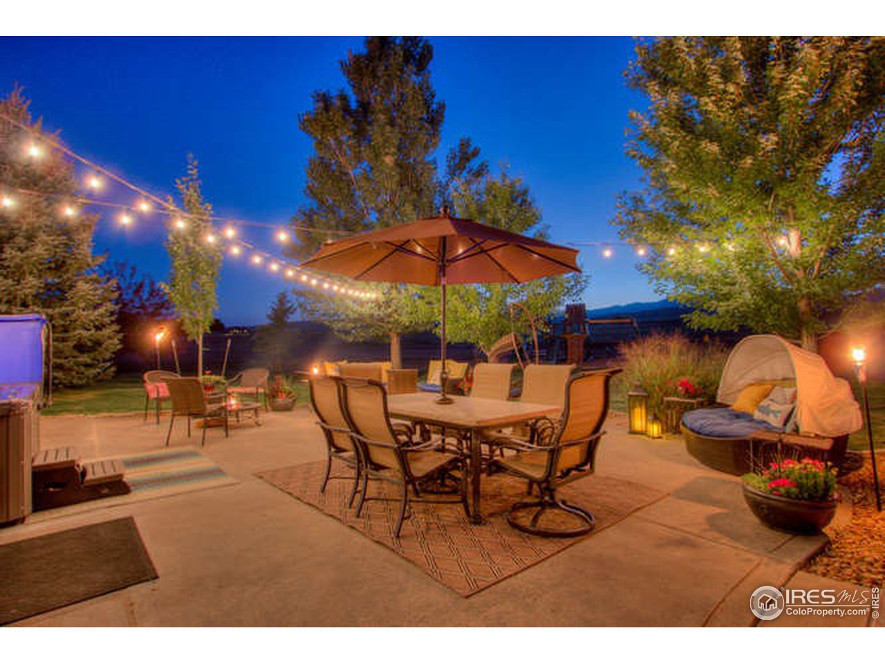 1441 Shelby Drive Berthoud, CO 80513 - Photo 9 of 40 a view of a backyard with a patio and fire pit