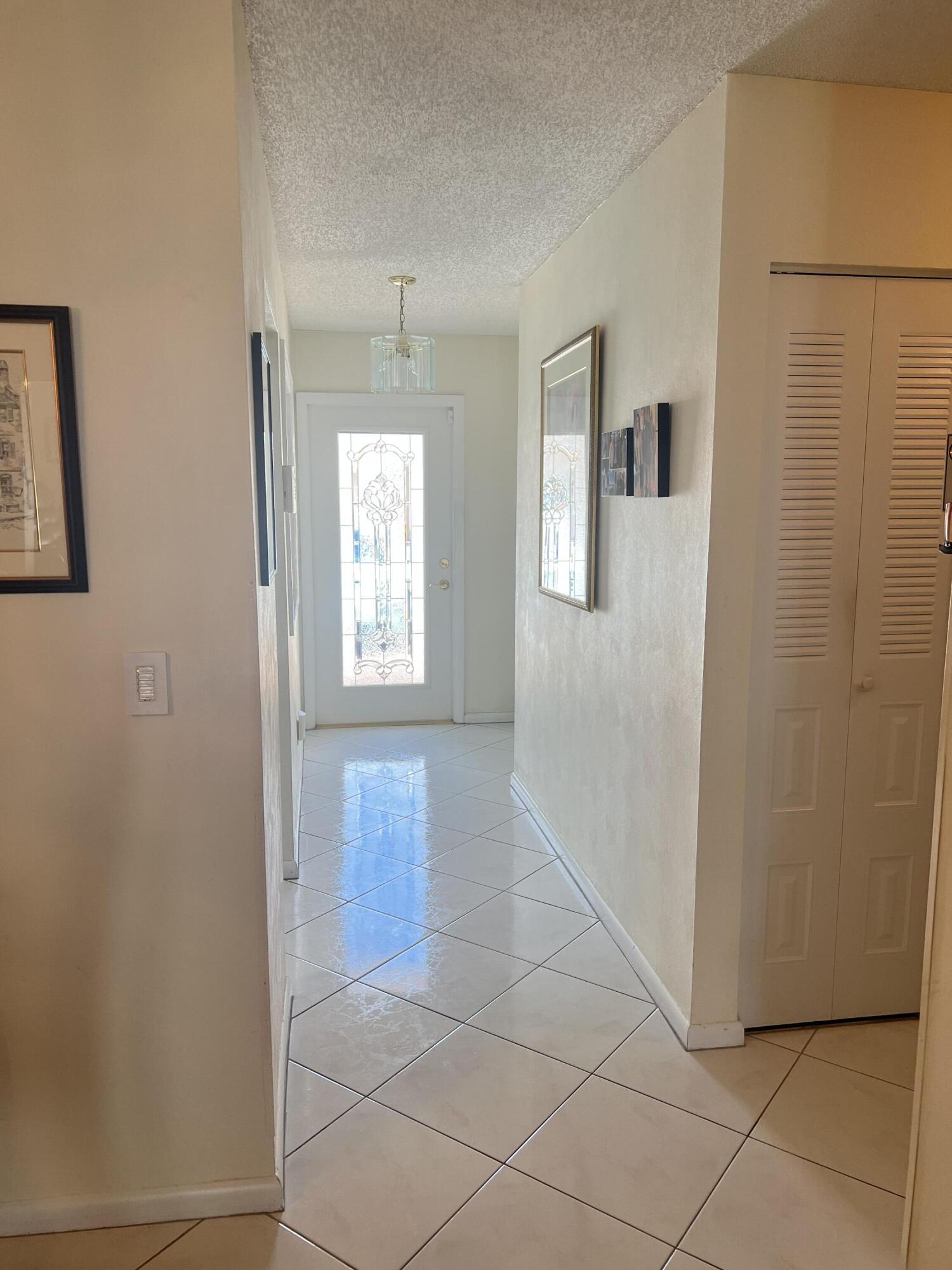6877 Moonlit Drive Delray Beach, FL 33446 - Photo 29 of 45 a view of a hallway with bathroom and a shower